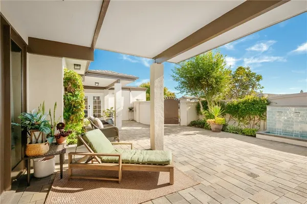 a kitchen with a table chairs sink and cabinets