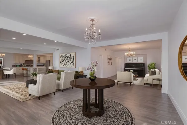 a bedroom with furniture and a flat screen tv