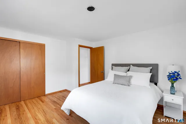 a bedroom with a bed and a closet