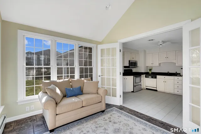 a living room with furniture and a large window