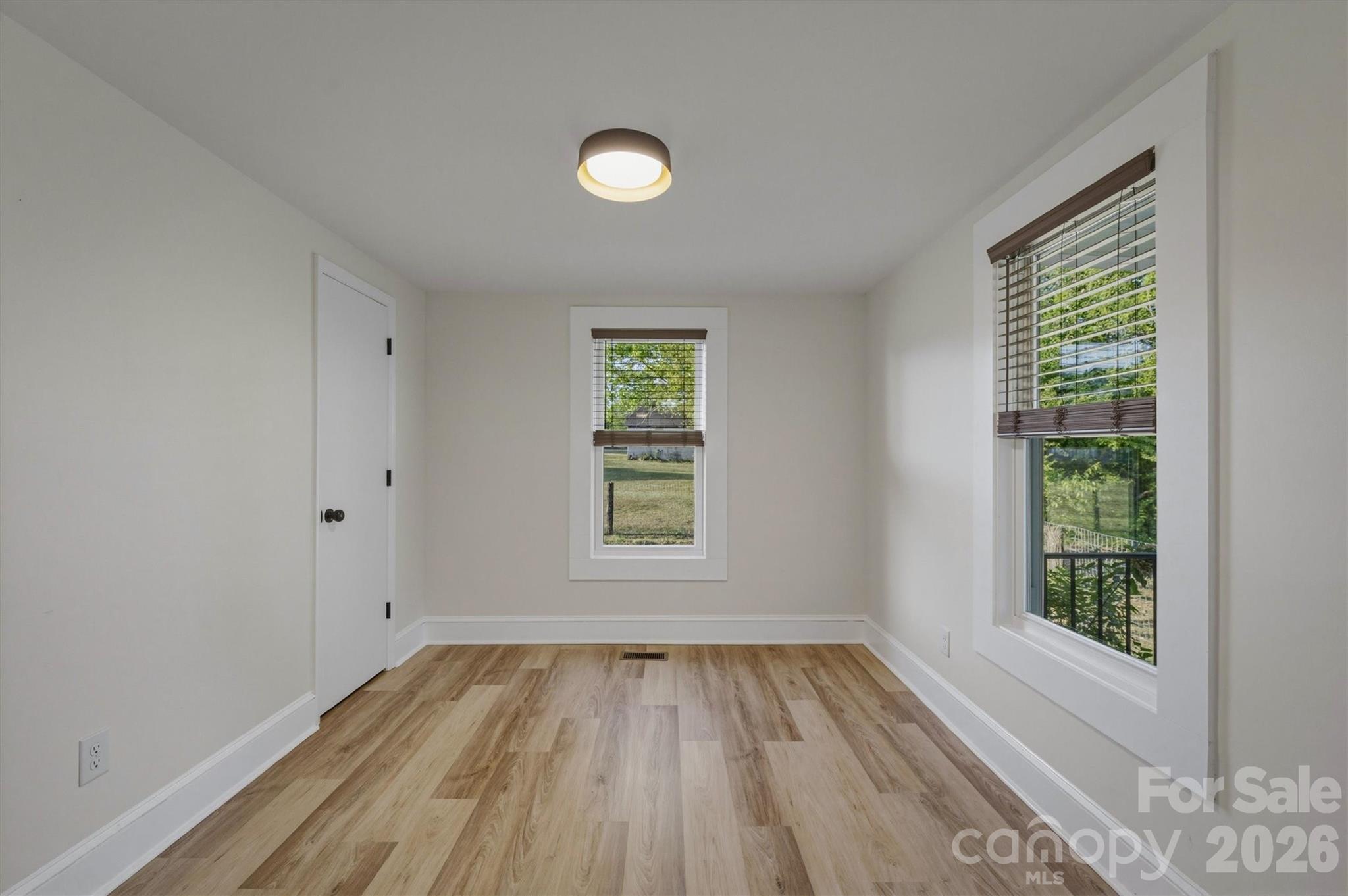 171 Duke Street Granite Falls, NC 28630 - Photo 13 of 15 an empty room with a hardwood and a window