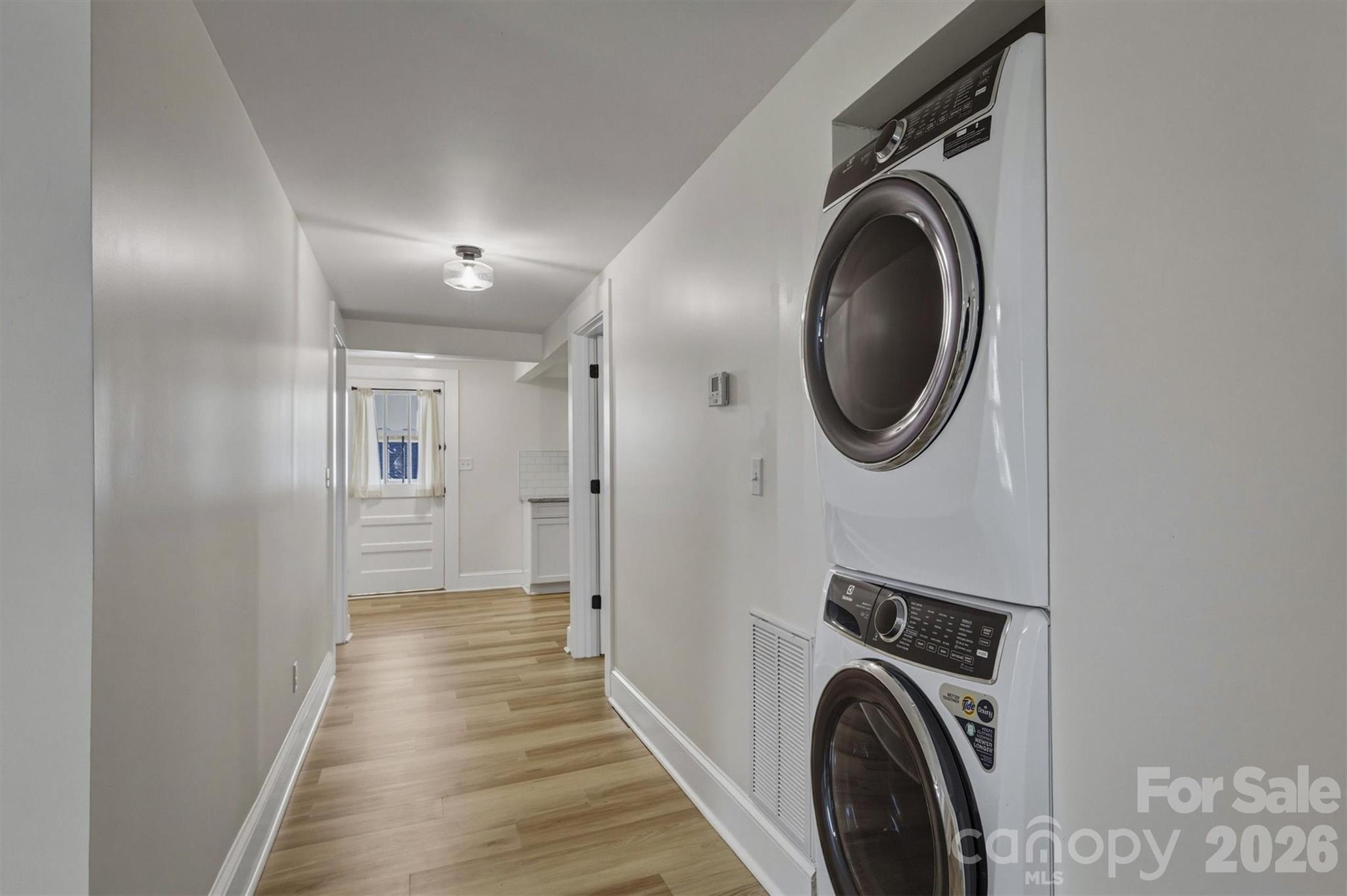 171 Duke Street Granite Falls, NC 28630 - Photo 14 of 15 a view of a hallway with washer and dryer