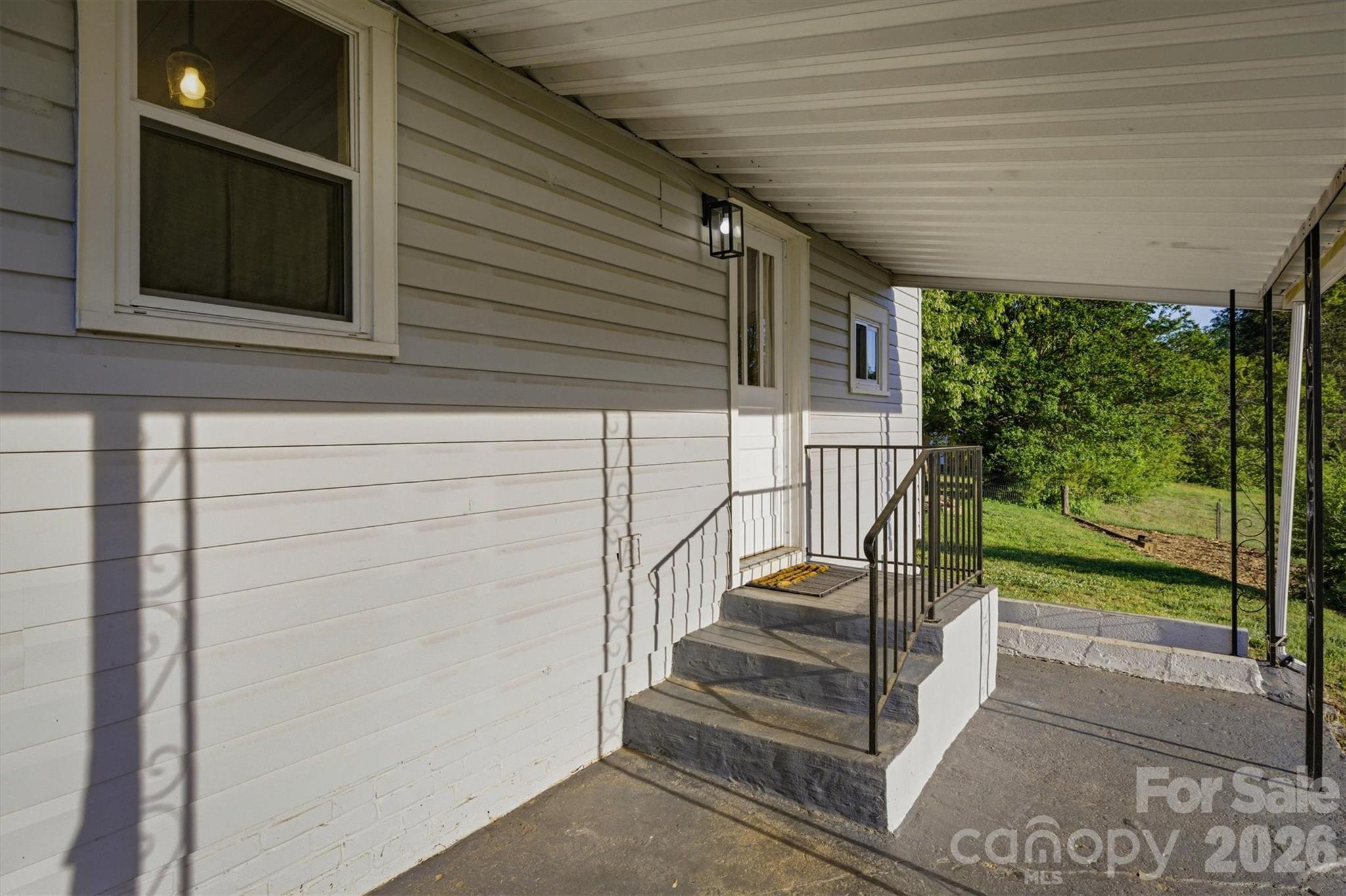 171 Duke Street Granite Falls, NC 28630 - Photo 15 of 15 a view of a balcony with stairs and wooden floor