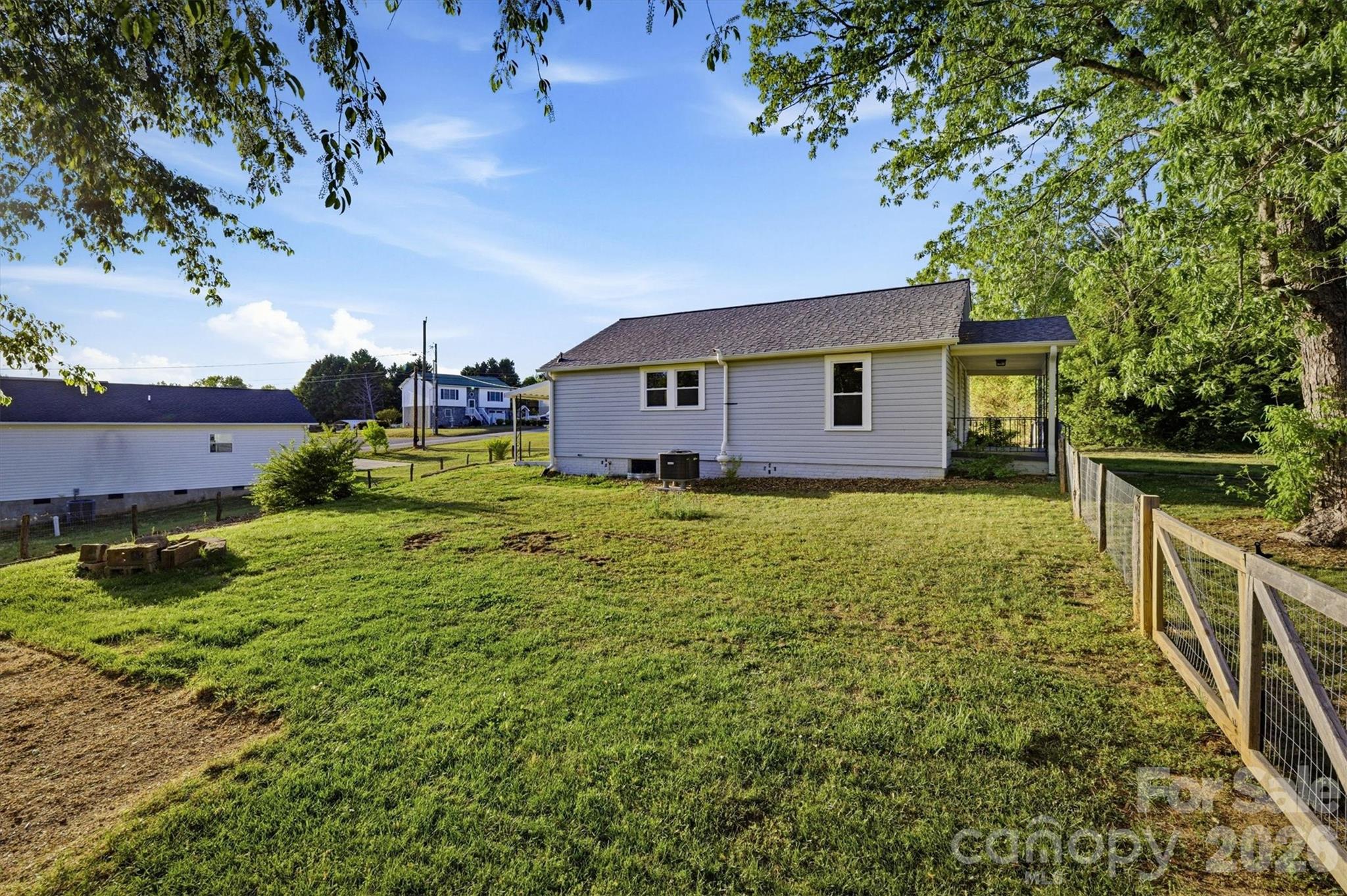 171 Duke Street Granite Falls, NC 28630 - Photo 4 of 15 a house view with a garden space