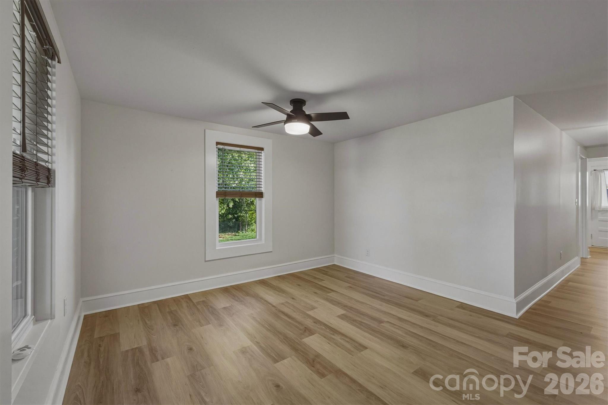 171 Duke Street Granite Falls, NC 28630 - Photo 6 of 15 wooden floor in an empty room with a window