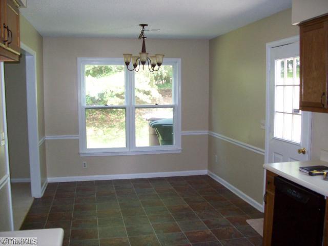 532 Apple Ridge Road Greensboro, NC 27406 - Photo 4 of 8 Dining Room. New paint, floor covering, dining light fixture.