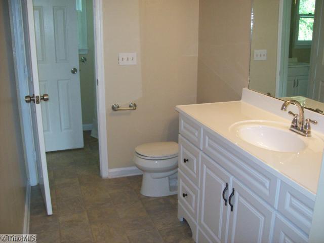 532 Apple Ridge Road Greensboro, NC 27406 - Photo 5 of 8 Master Bath/Spa. New vanities cabinets, countertops, sink fixture, tub fixture, toilet, floor covering, paint, light fixture.
