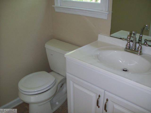 532 Apple Ridge Road Greensboro, NC 27406 - Photo 6 of 8 Other. 1/2 Bath, New cabinet, countertops, plumbing fixture, toilet, light fixture , floor covering, paint.