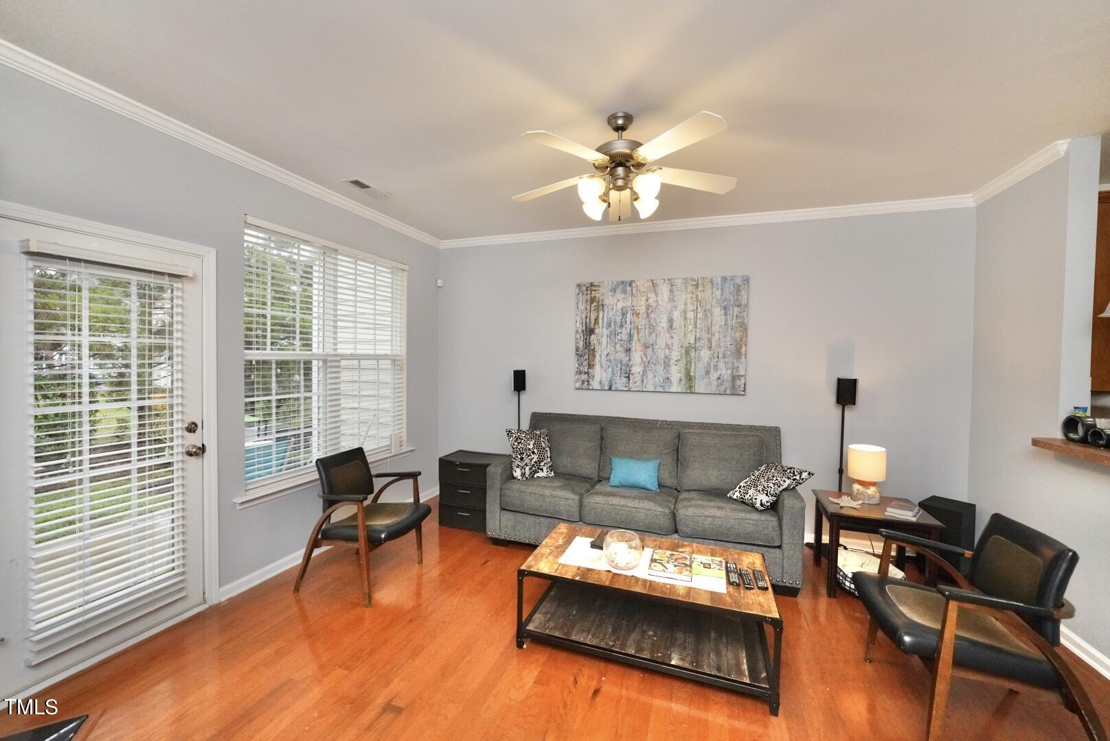 7815 Silverthread Lane Raleigh, NC 27617 - Photo 18 of 32 a living room with furniture fireplace and a large window