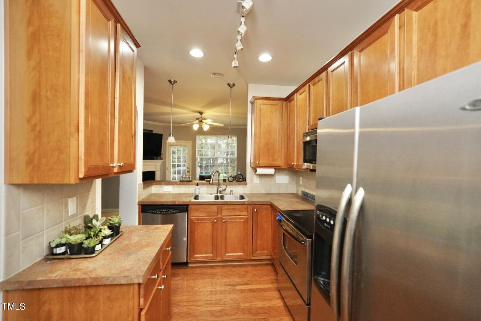 7815 Silverthread Lane Raleigh, NC 27617 - Photo 10 of 32 a kitchen with lots of counter top space