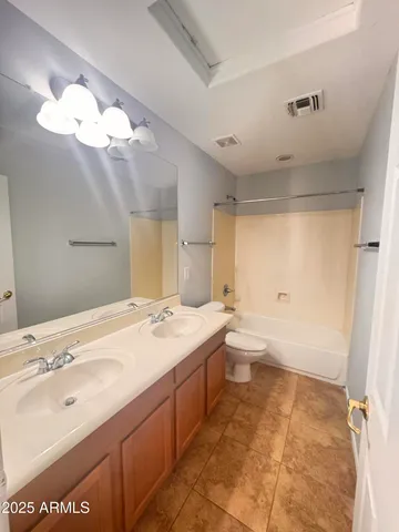 a bathroom with a sink a toilet and a bathtub