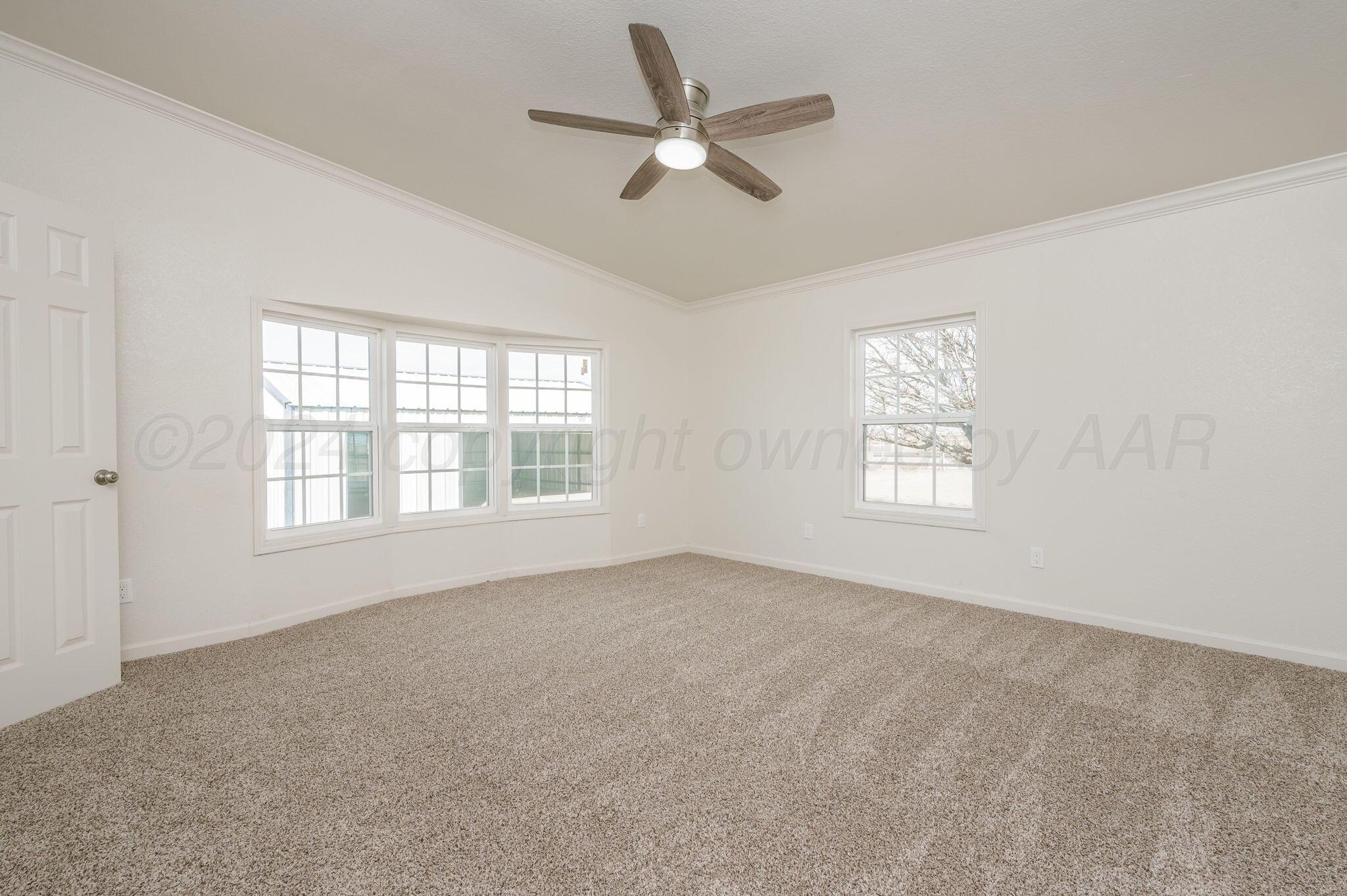 401 West Plantation Road Amarillo, TX 79118 - Photo 12 of 23 a view of an empty room with a window