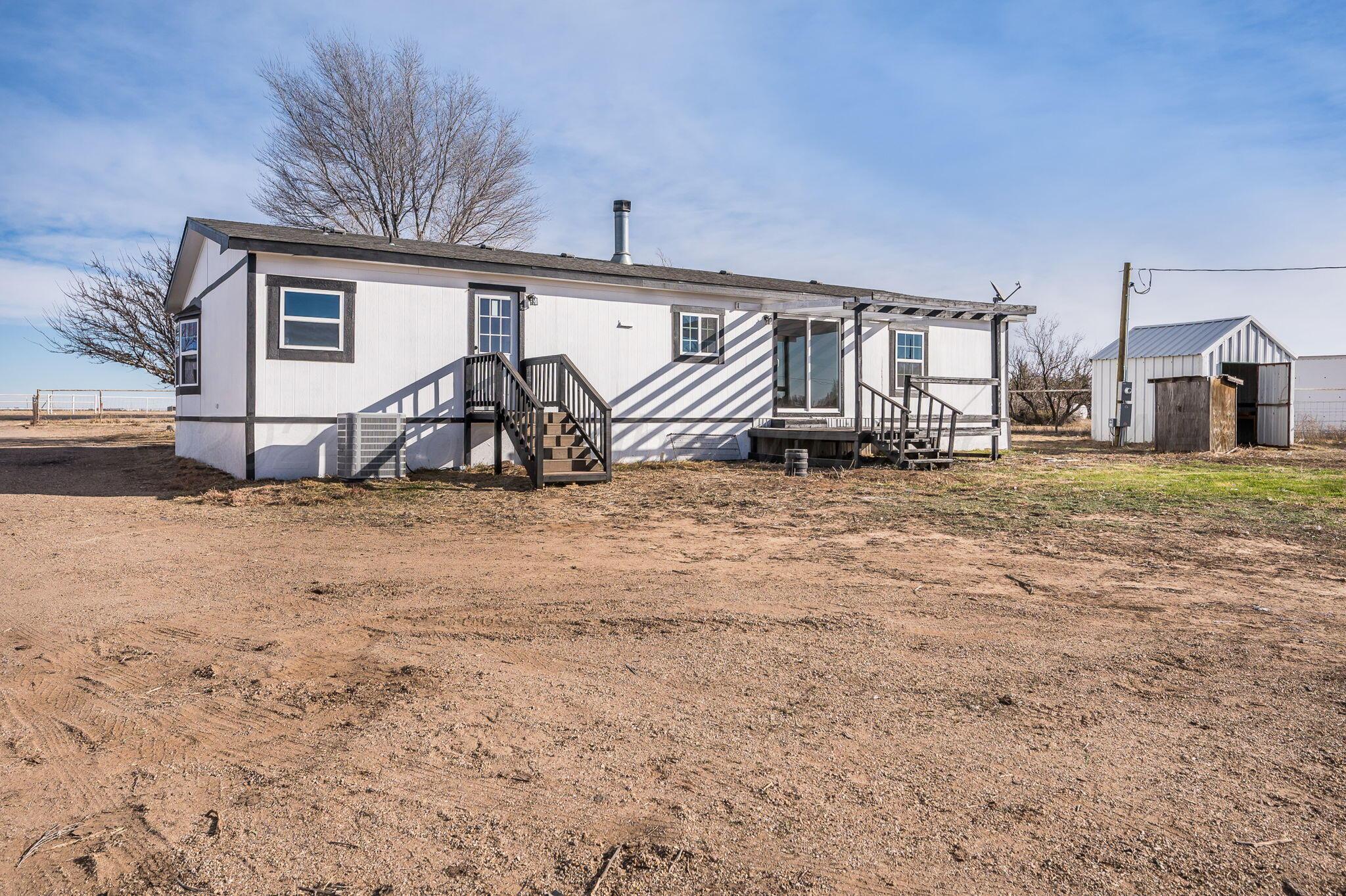 401 West Plantation Road Amarillo, TX 79118 - Photo 20 of 23 a view of a house with backyard