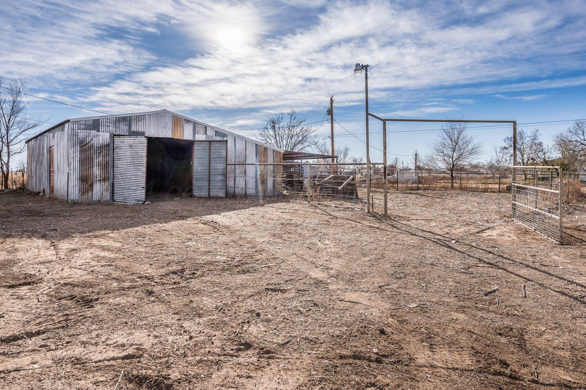 401 West Plantation Road Amarillo, TX 79118 - Photo 22 of 23 a view of a dry yard with wooden fence