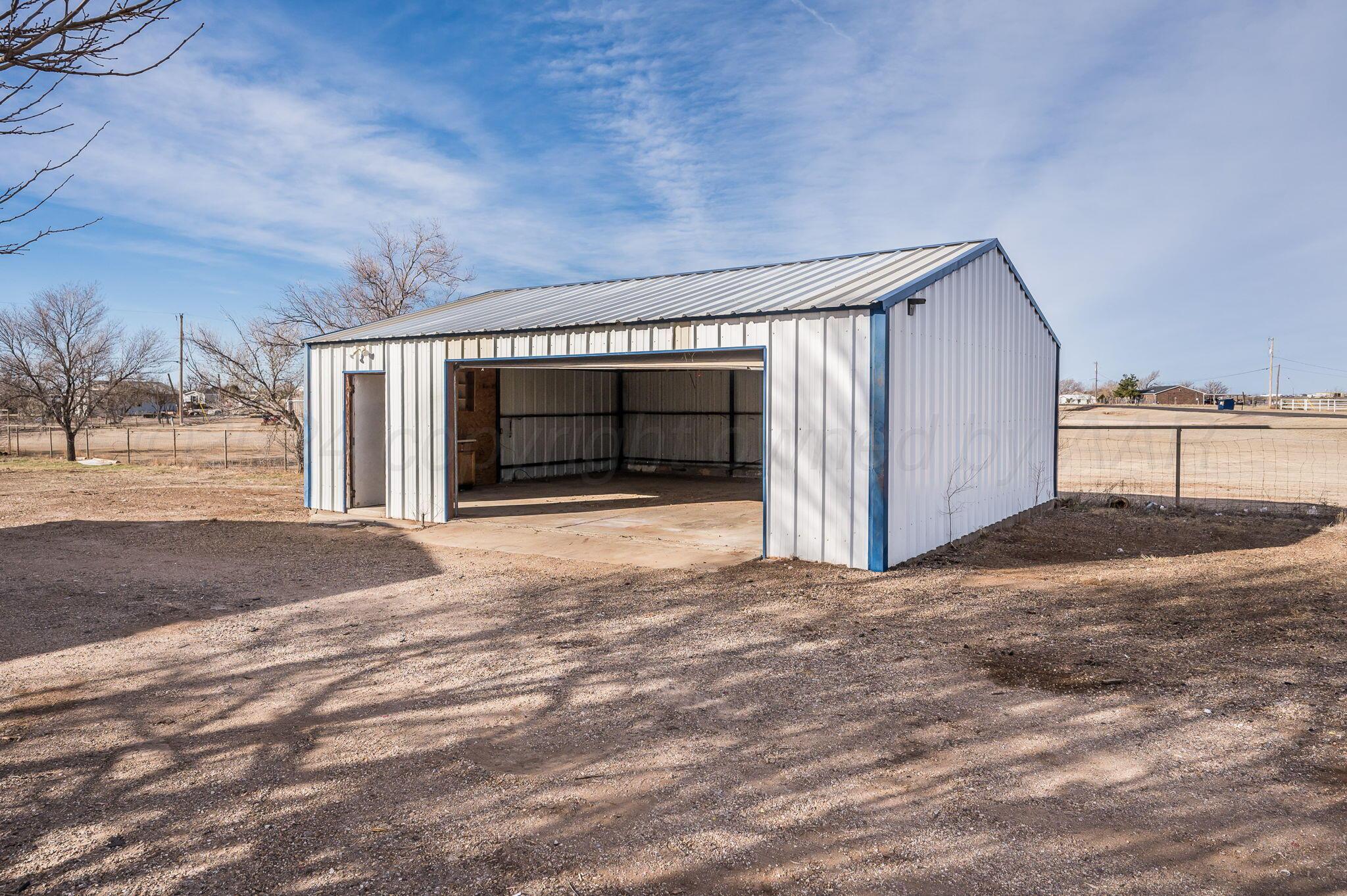 401 West Plantation Road Amarillo, TX 79118 - Photo 23 of 23 a view of livingroom with an empty space and a garage