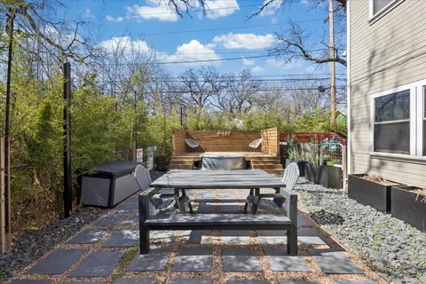 a view of a dinning table and chairs in the patio