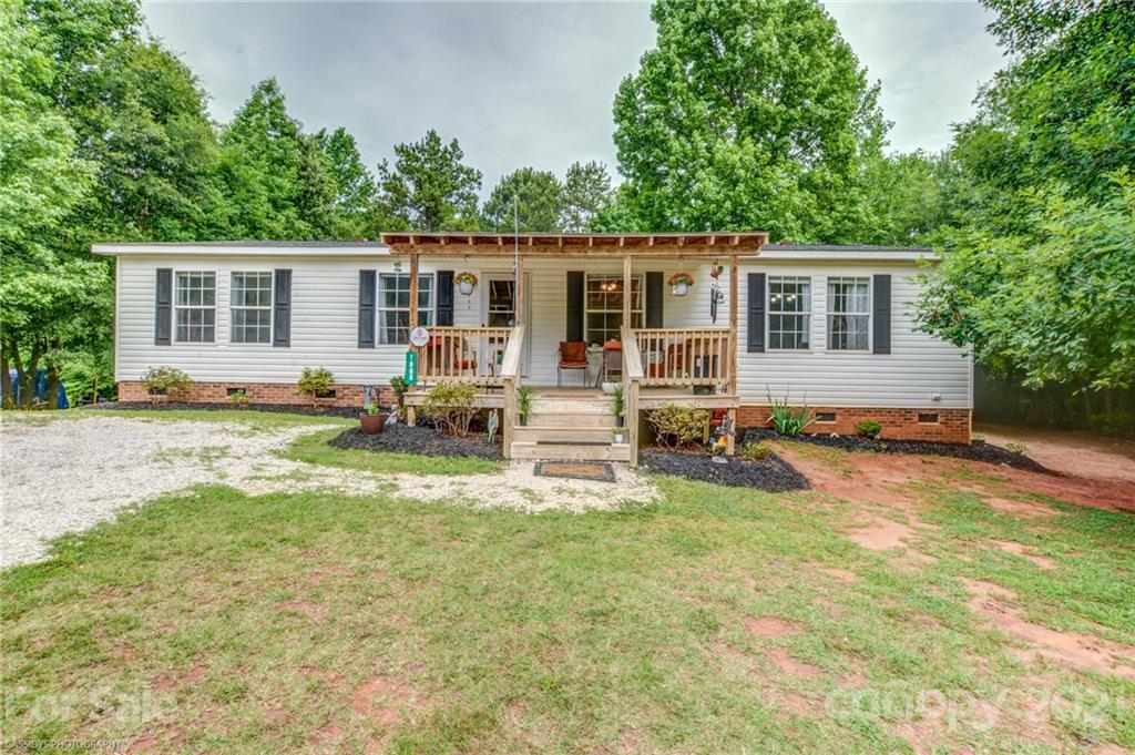 1968 Steel Hill Road Lancaster, SC 29720 - Photo 1 of 28 front view of a house with a patio