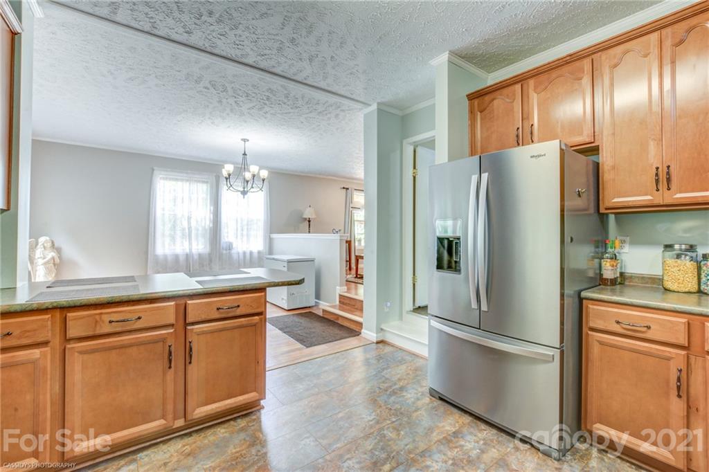1968 Steel Hill Road Lancaster, SC 29720 - Photo 18 of 28 a kitchen with stainless steel appliances granite countertop a refrigerator a sink and a stove