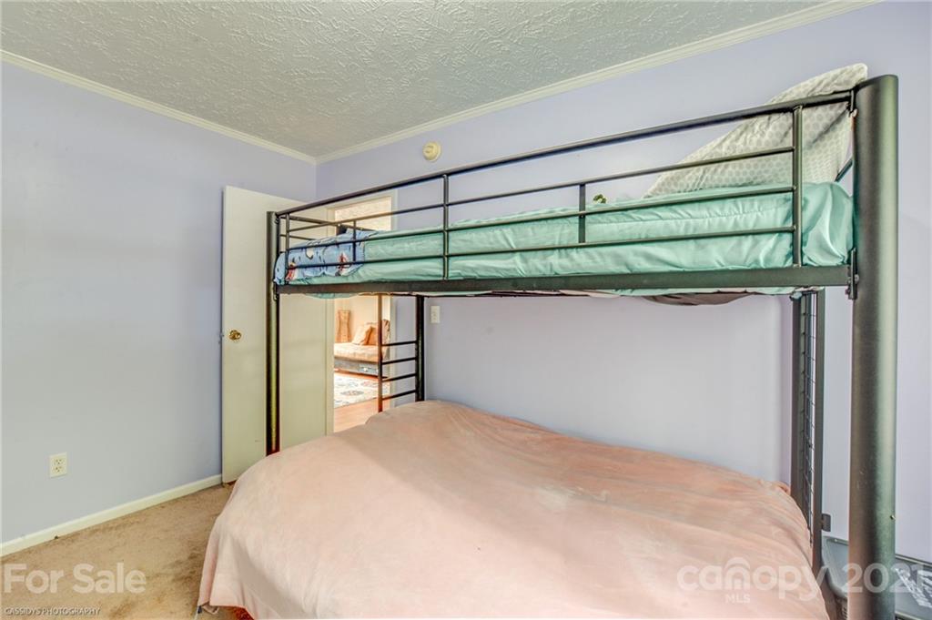 1968 Steel Hill Road Lancaster, SC 29720 - Photo 21 of 28 a bedroom with a bed and a window