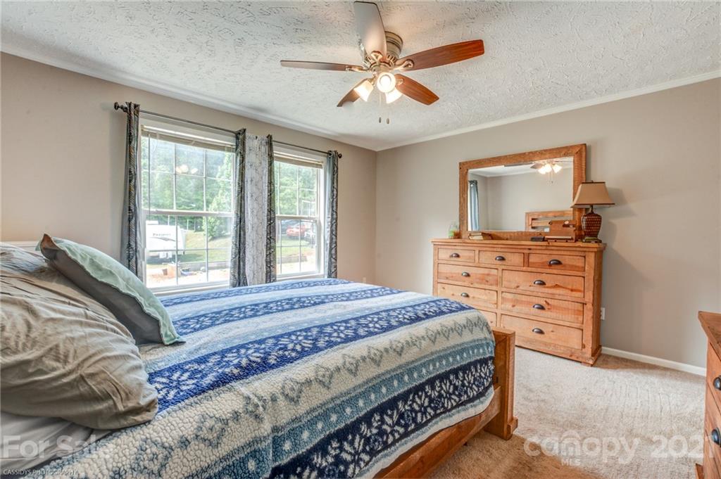 1968 Steel Hill Road Lancaster, SC 29720 - Photo 24 of 28 a bedroom with a large bed and a window