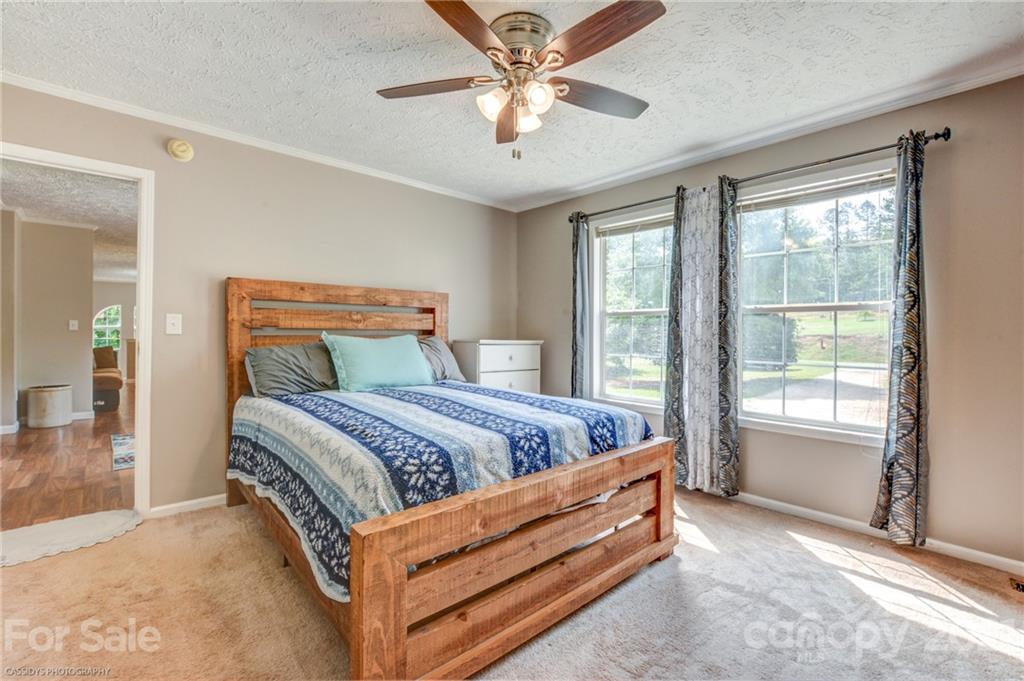 1968 Steel Hill Road Lancaster, SC 29720 - Photo 25 of 28 a bed sitting in a bedroom next to a window