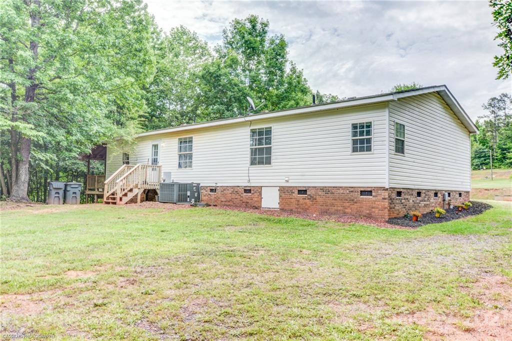 1968 Steel Hill Road Lancaster, SC 29720 - Photo 6 of 28 a view of a house with a backyard