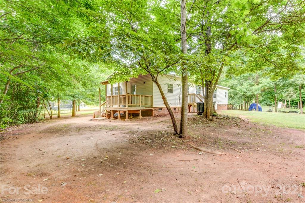 1968 Steel Hill Road Lancaster, SC 29720 - Photo 7 of 28 a house with trees in front of it