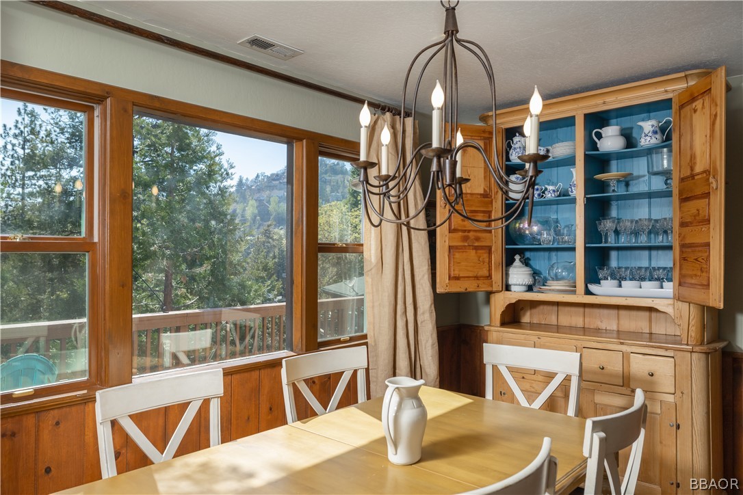 841 Golf Course Road Lake Arrowhead, CA 92352 - Photo 12 of 43 a view of a dining room with furniture window and outside view