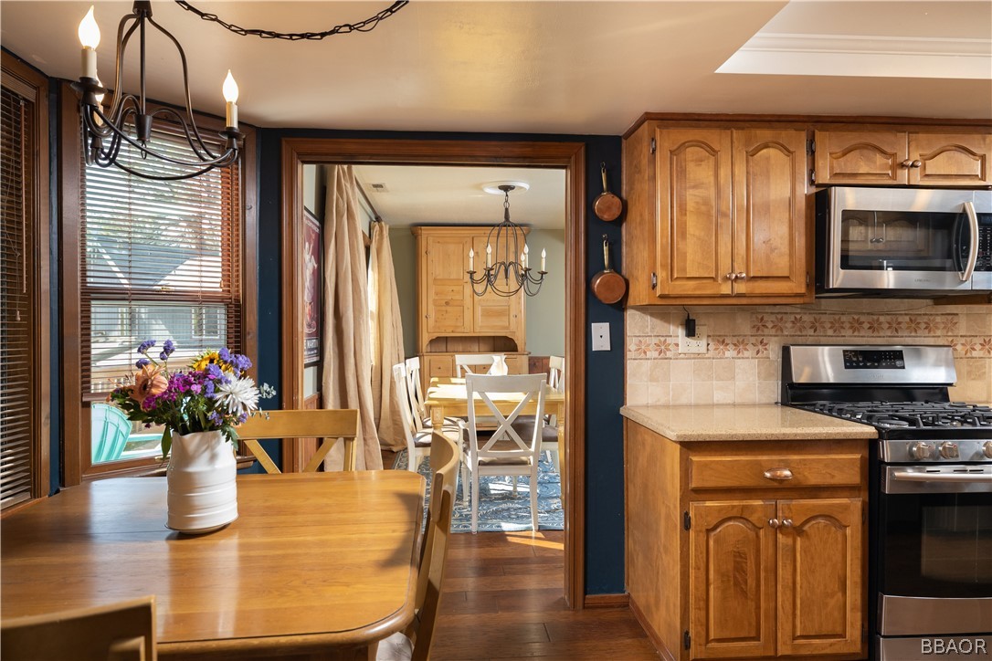 841 Golf Course Road Lake Arrowhead, CA 92352 - Photo 13 of 43 a kitchen with a refrigerator and a stove top oven