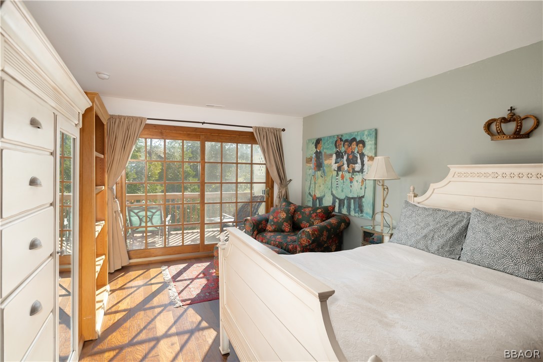 841 Golf Course Road Lake Arrowhead, CA 92352 - Photo 19 of 43 a bedroom with a bed and a large window