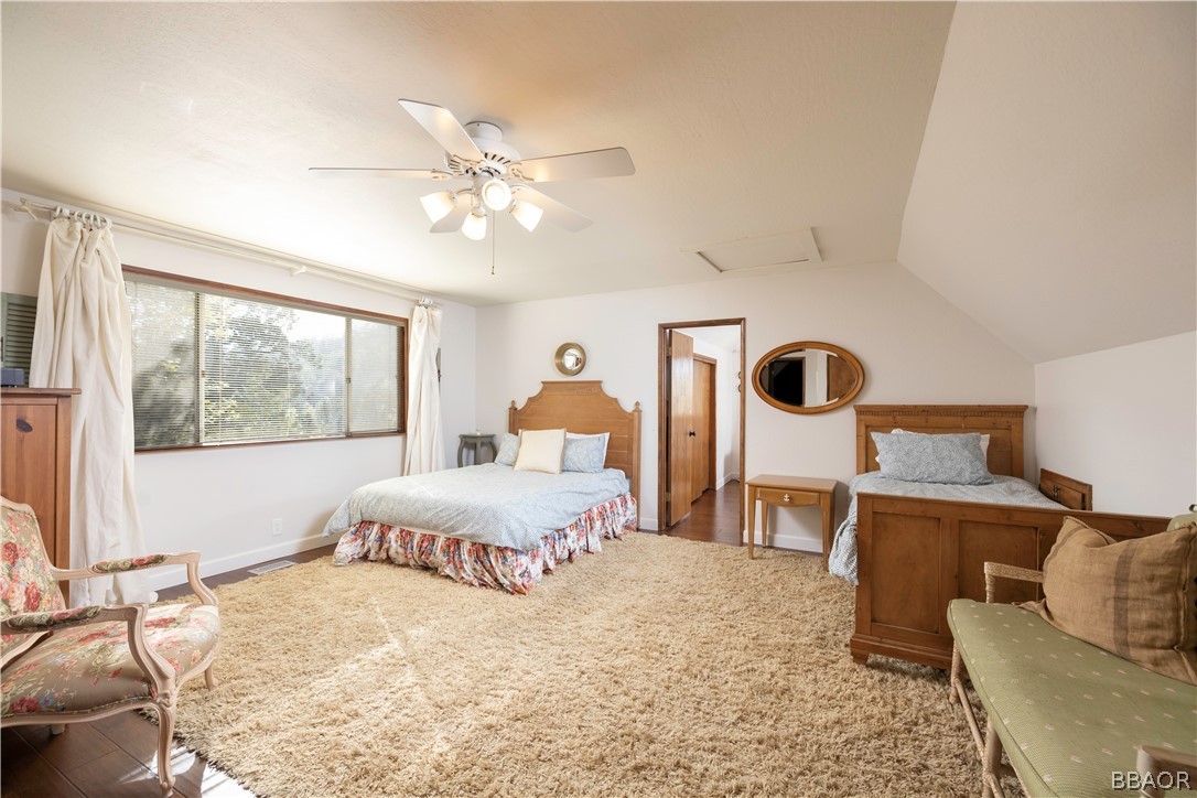 841 Golf Course Road Lake Arrowhead, CA 92352 - Photo 23 of 43 a bedroom with a bed and wooden floor