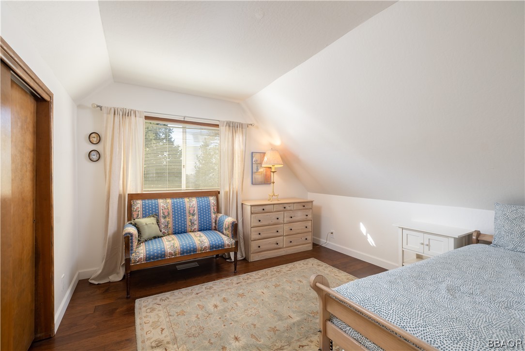 841 Golf Course Road Lake Arrowhead, CA 92352 - Photo 24 of 43 a bedroom with furniture and a window