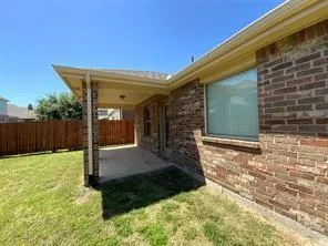 a view of backyard with small cabin