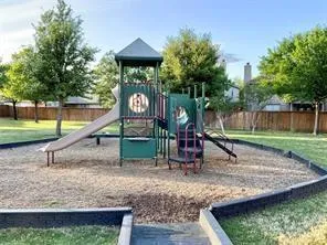 a view of a park with a slide