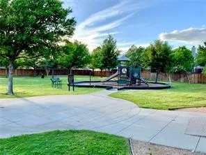 a view of a park with swings