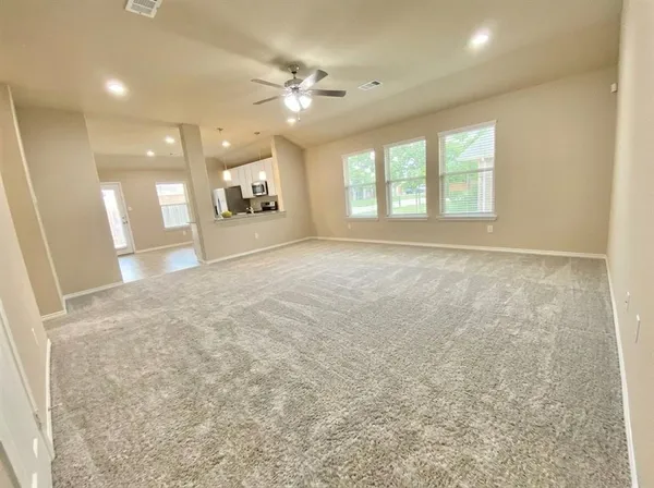 a view of an empty room with a window