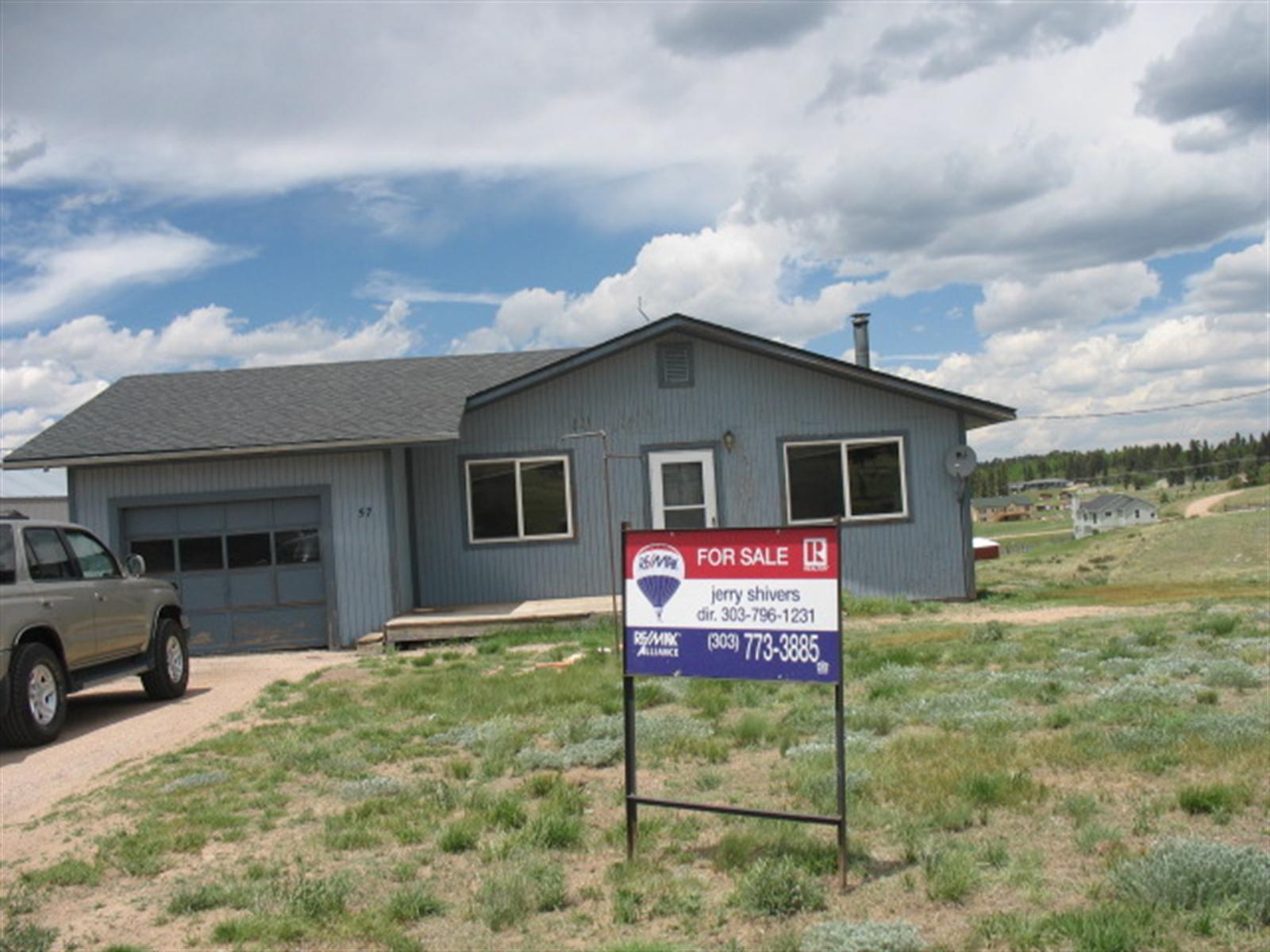 57 Ridge Point Circle Divide, CO 80814 - Photo 1 of 1 a view of a house with backyard