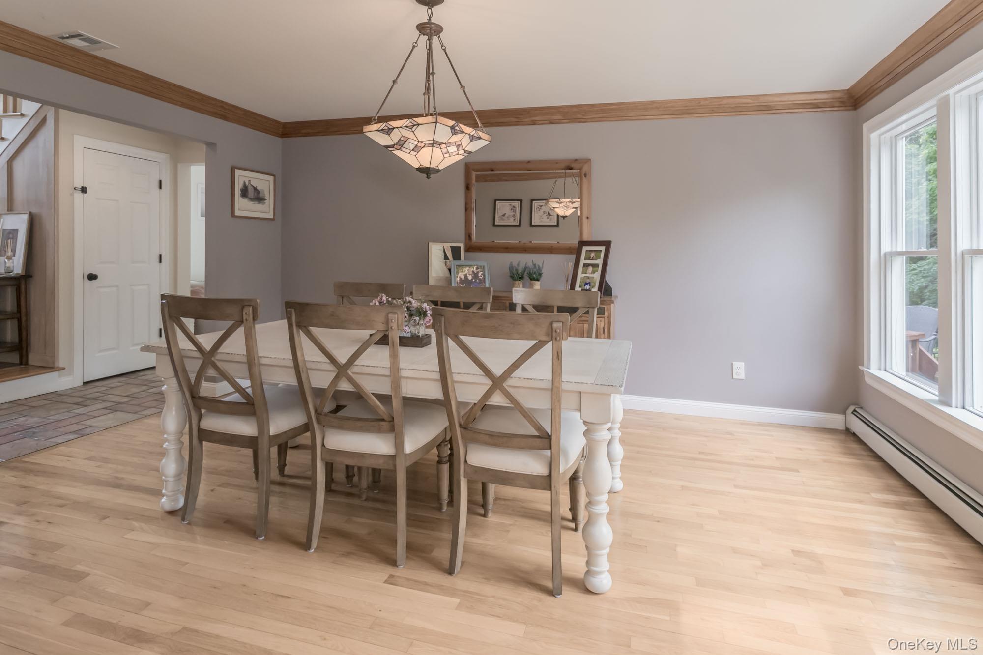 102 Beverly Road Chester, NY 10918 - Photo 20 of 49 a view of a dining room with furniture window and wooden floor