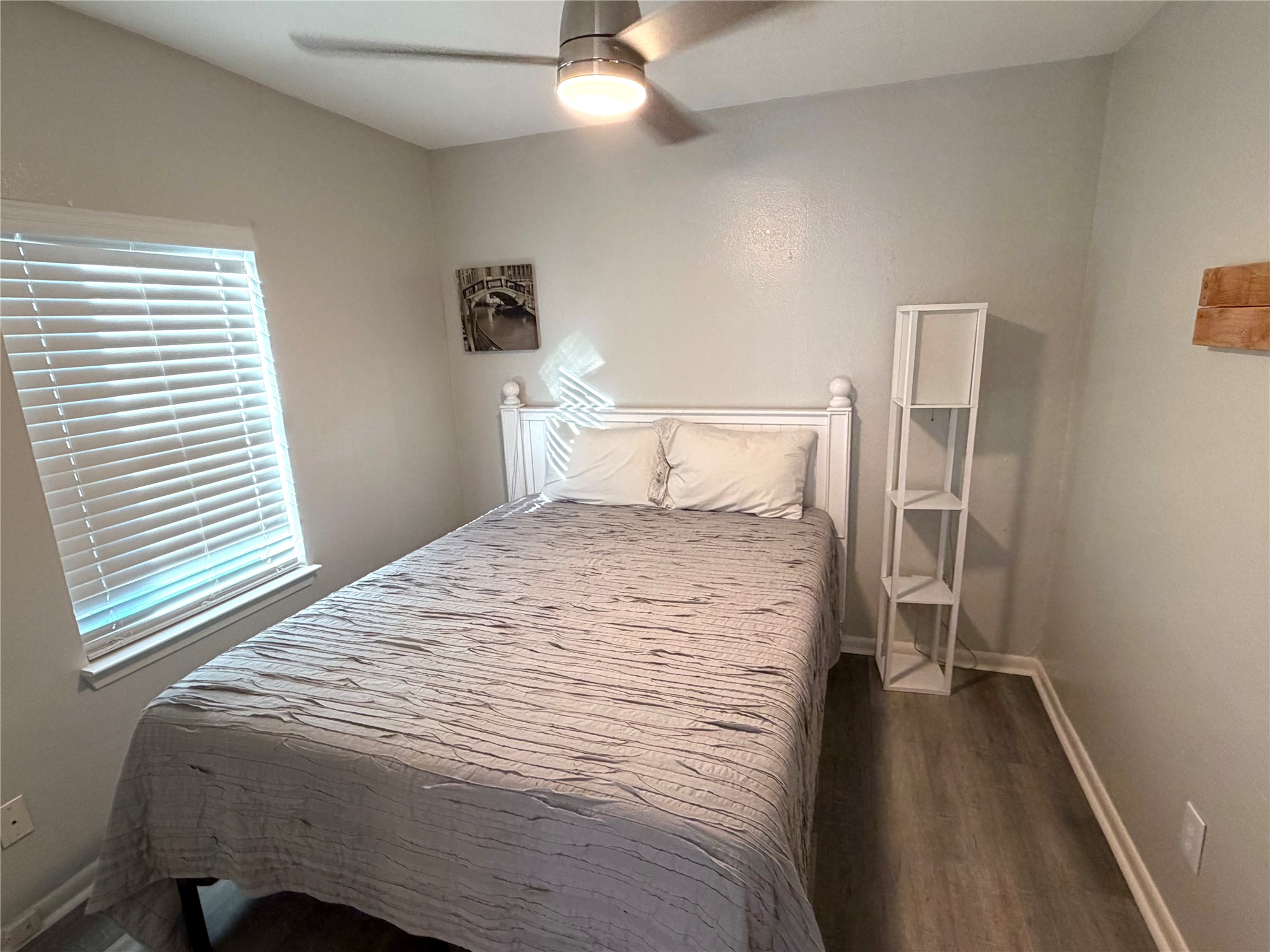 2208 Garden Street, Unit B Austin, TX 78702 - Photo 7 of 10 a bedroom with a bed and a walk in closet