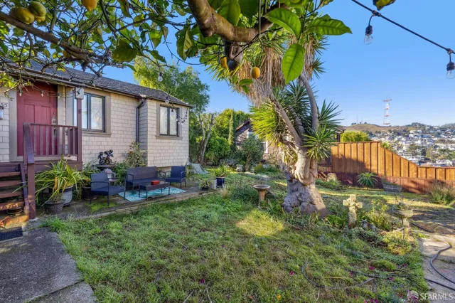 a view of a chair and table in the garden