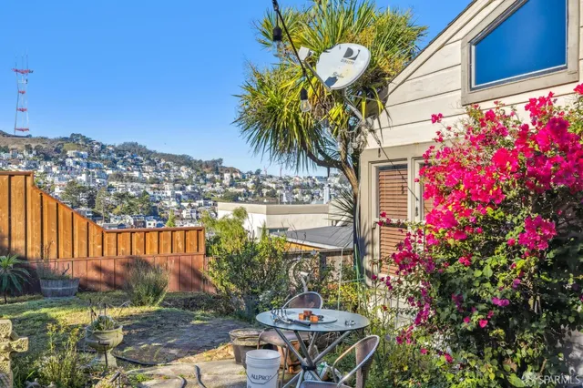 a front view of a house with a yard and fountain