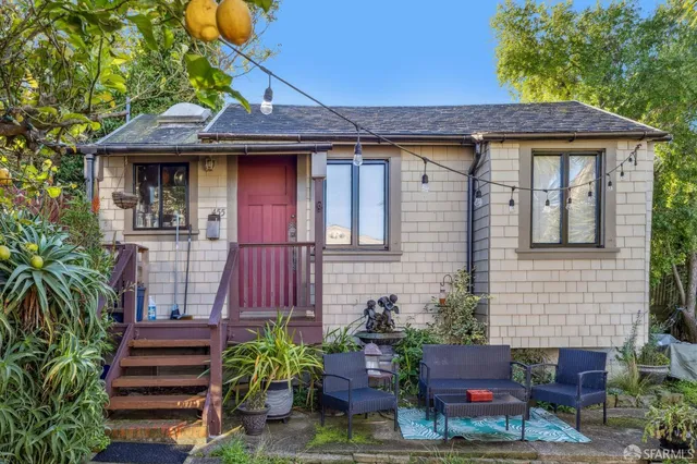 a front view of a house with garden