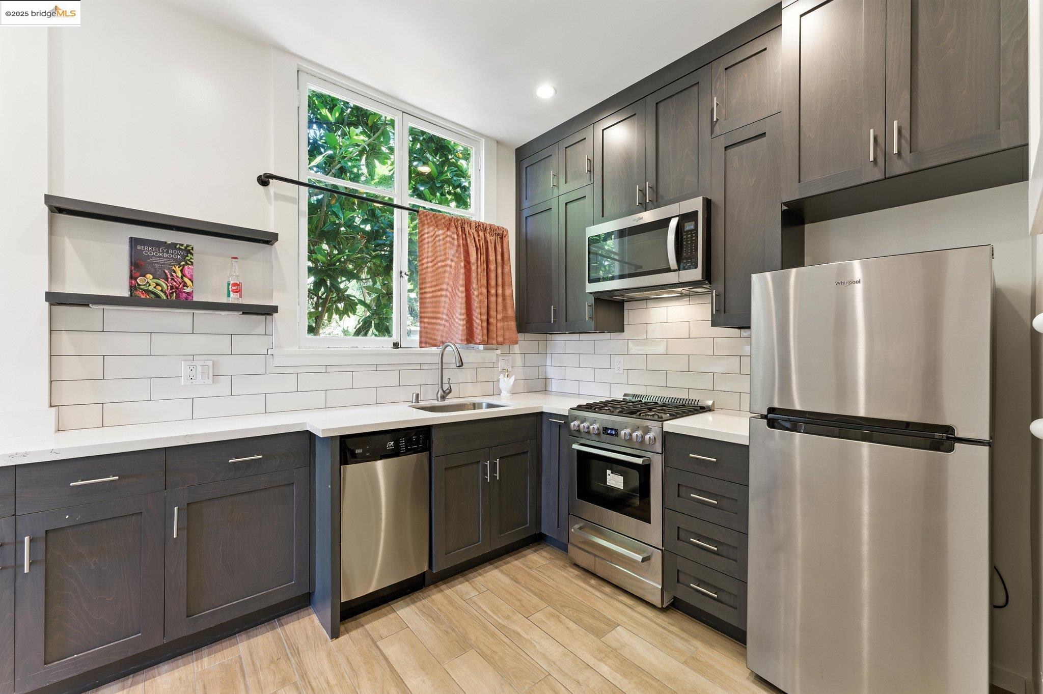 7 Panoramic Way Berkeley, CA 94704 - Photo 21 of 47 a kitchen with stainless steel appliances granite countertop a refrigerator a sink dishwasher a stove and a refrigerator