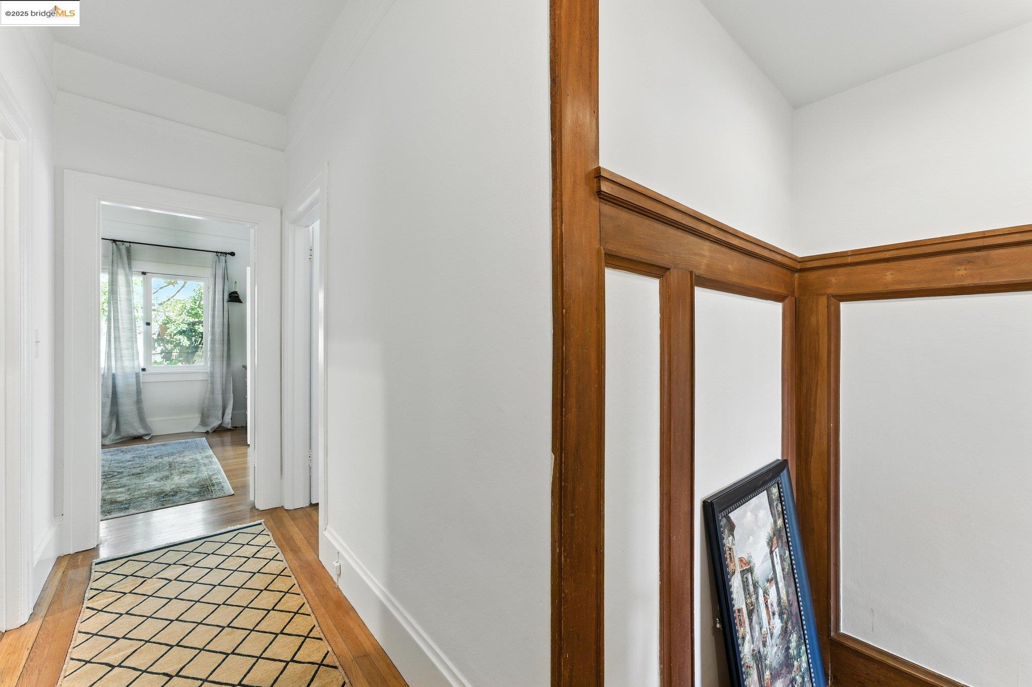 7 Panoramic Way Berkeley, CA 94704 - Photo 24 of 47 a view of a hallway with wooden floor and a bathroom