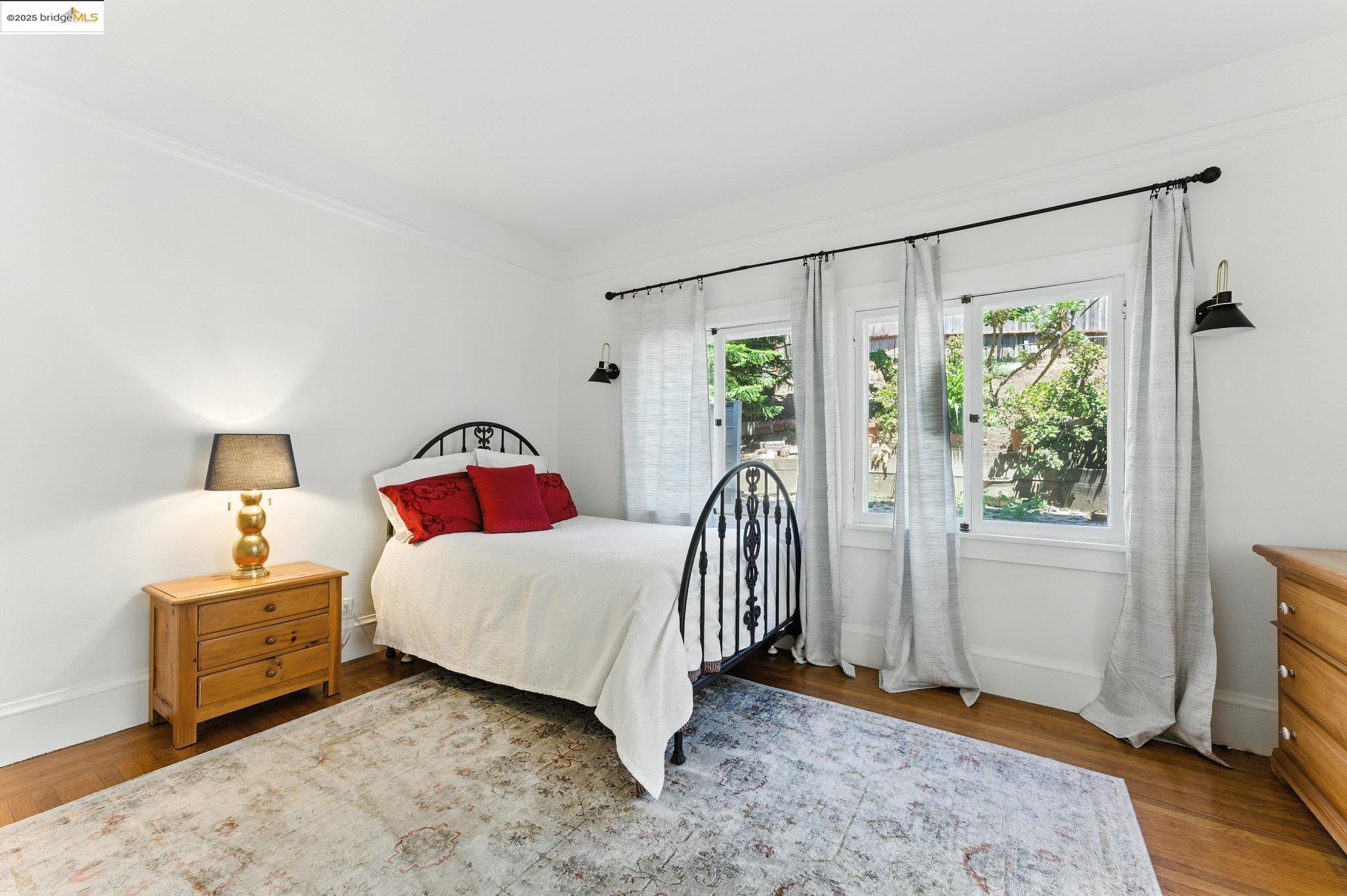 7 Panoramic Way Berkeley, CA 94704 - Photo 26 of 47 a bedroom with a bed and a window