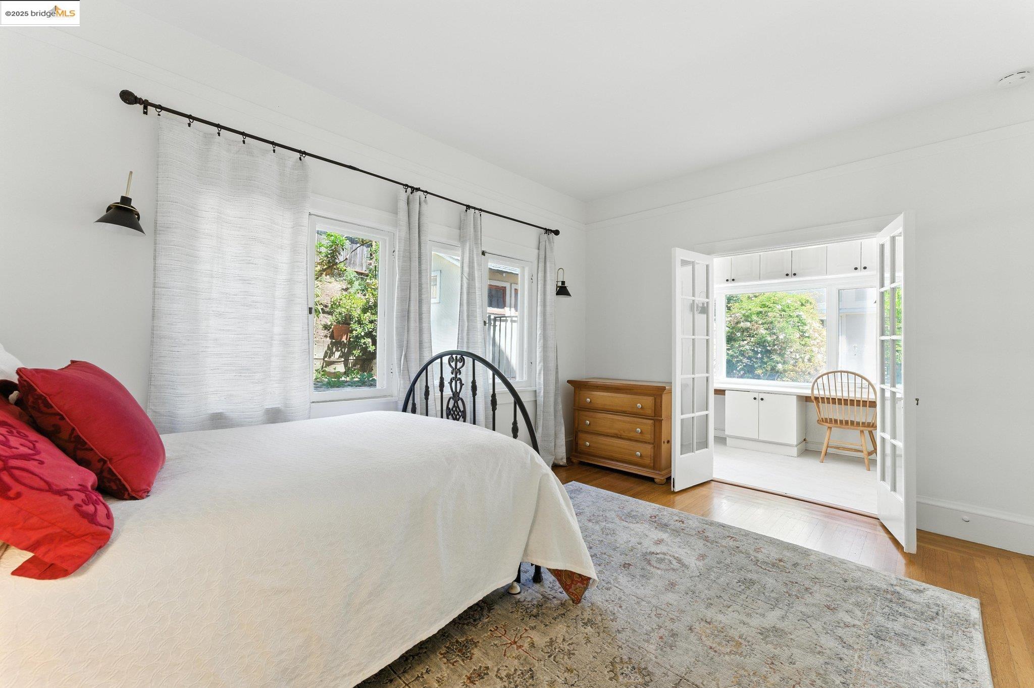 7 Panoramic Way Berkeley, CA 94704 - Photo 28 of 47 a bedroom with a large bed and a window