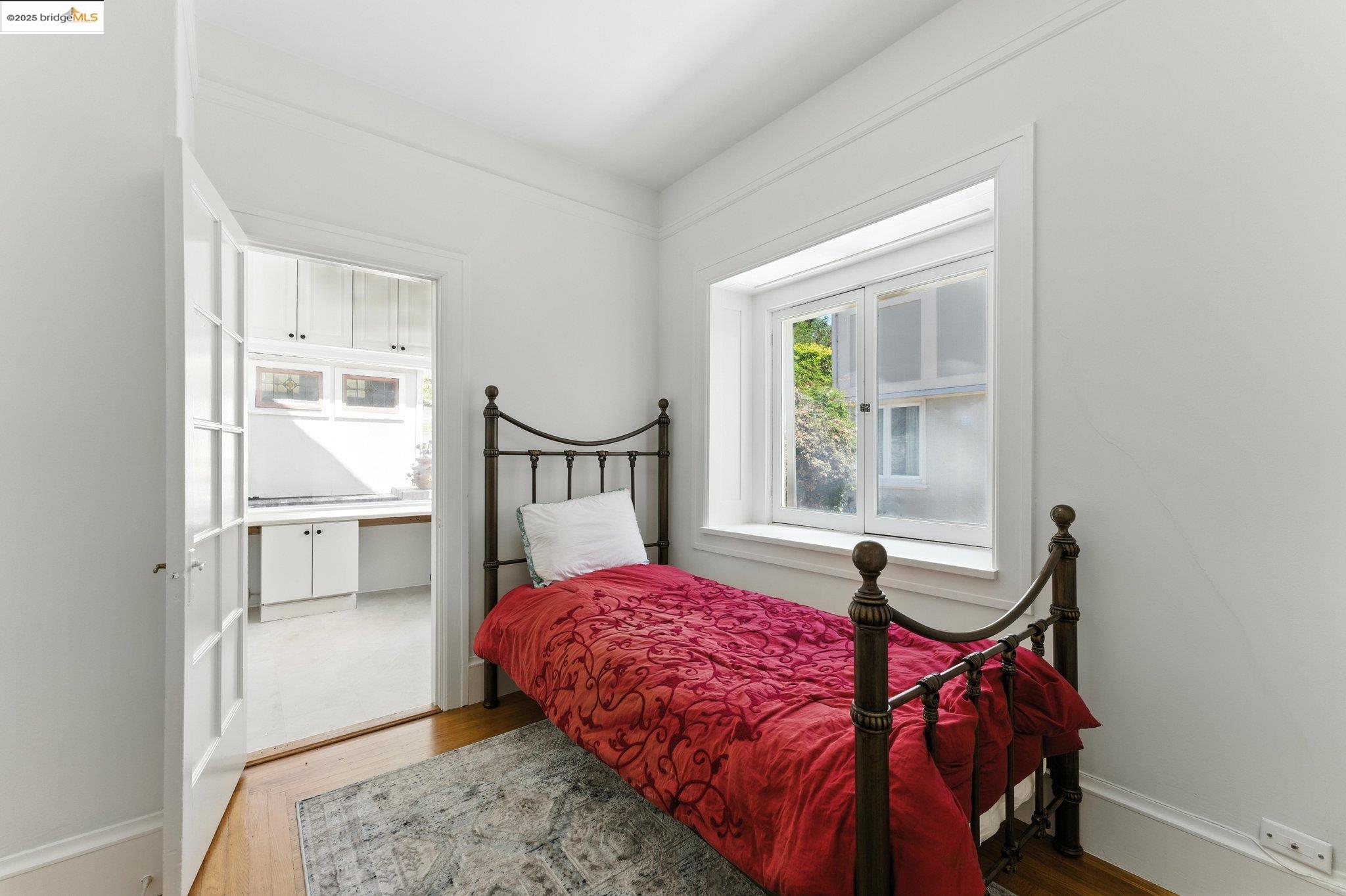 7 Panoramic Way Berkeley, CA 94704 - Photo 29 of 47 a bedroom with a bed and a window