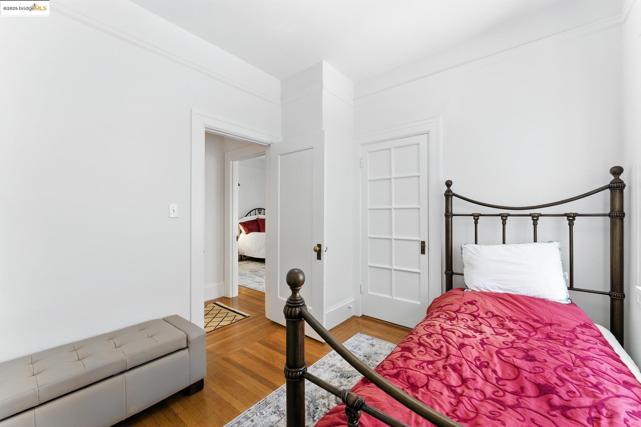 7 Panoramic Way Berkeley, CA 94704 - Photo 30 of 47 a bedroom with a bed and a lamp with the dresser