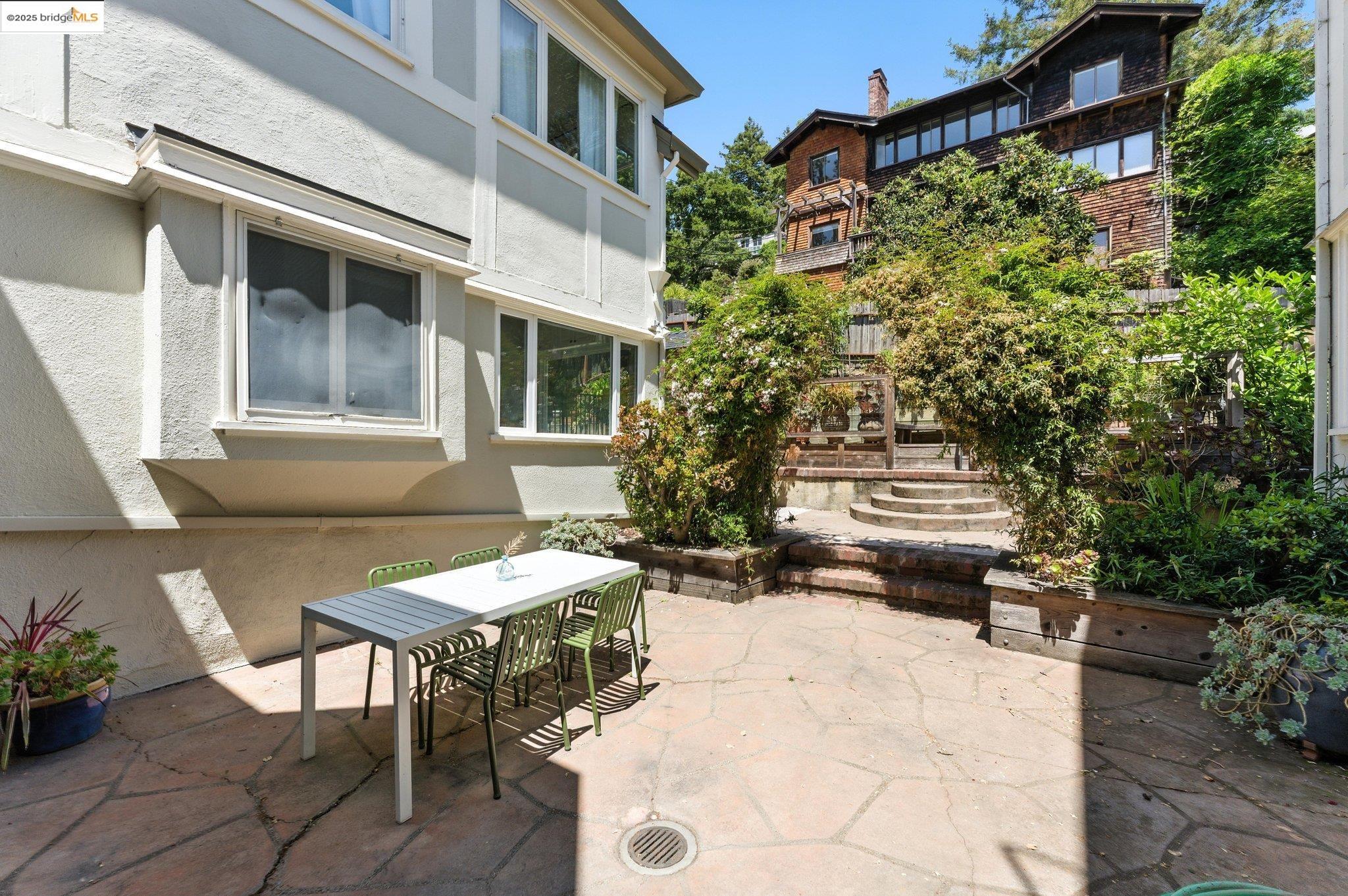 7 Panoramic Way Berkeley, CA 94704 - Photo 35 of 47 a view of a patio with table and chairs and potted plants