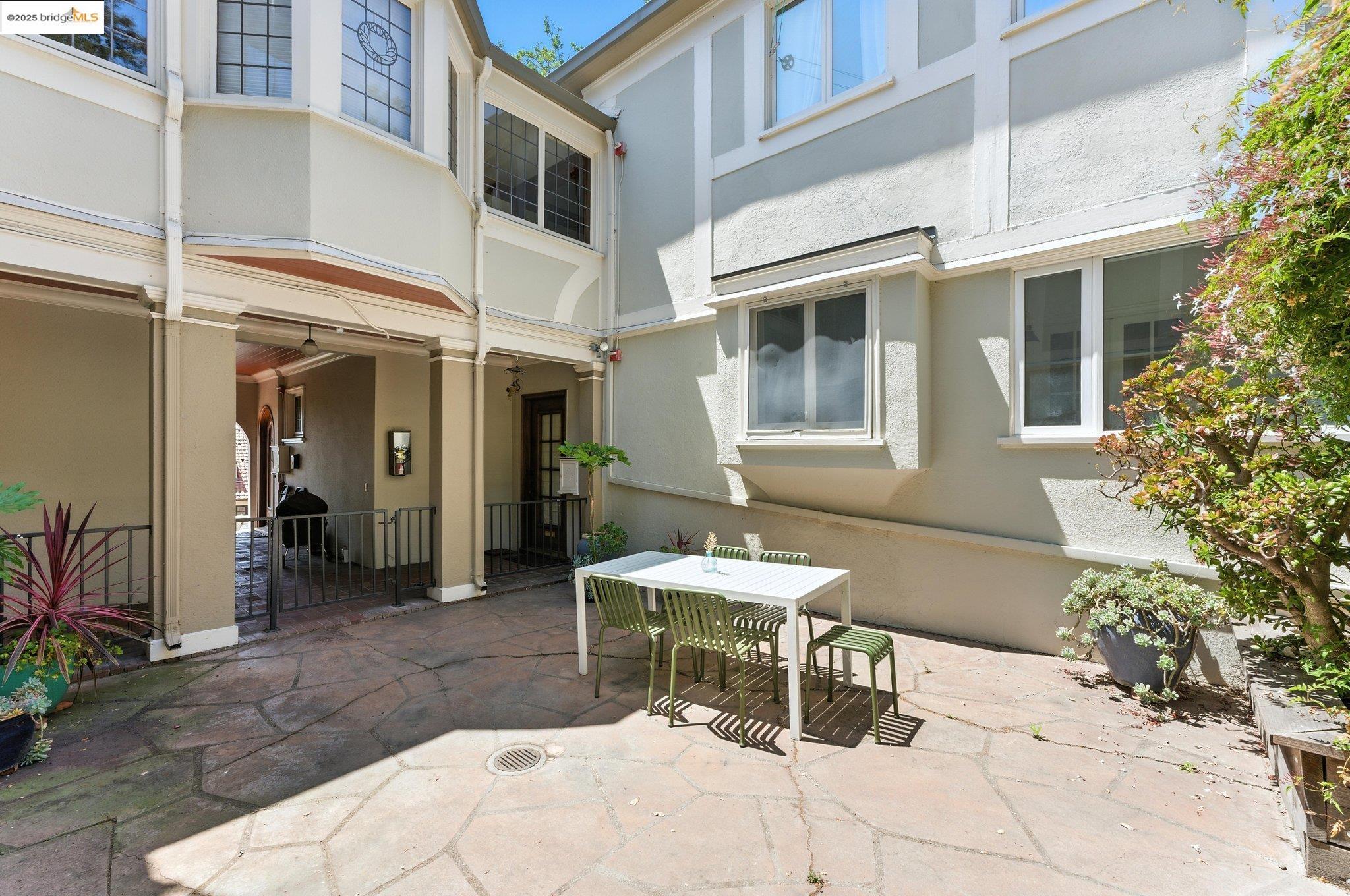 7 Panoramic Way Berkeley, CA 94704 - Photo 41 of 47 a row of table and chair in the patio of a house
